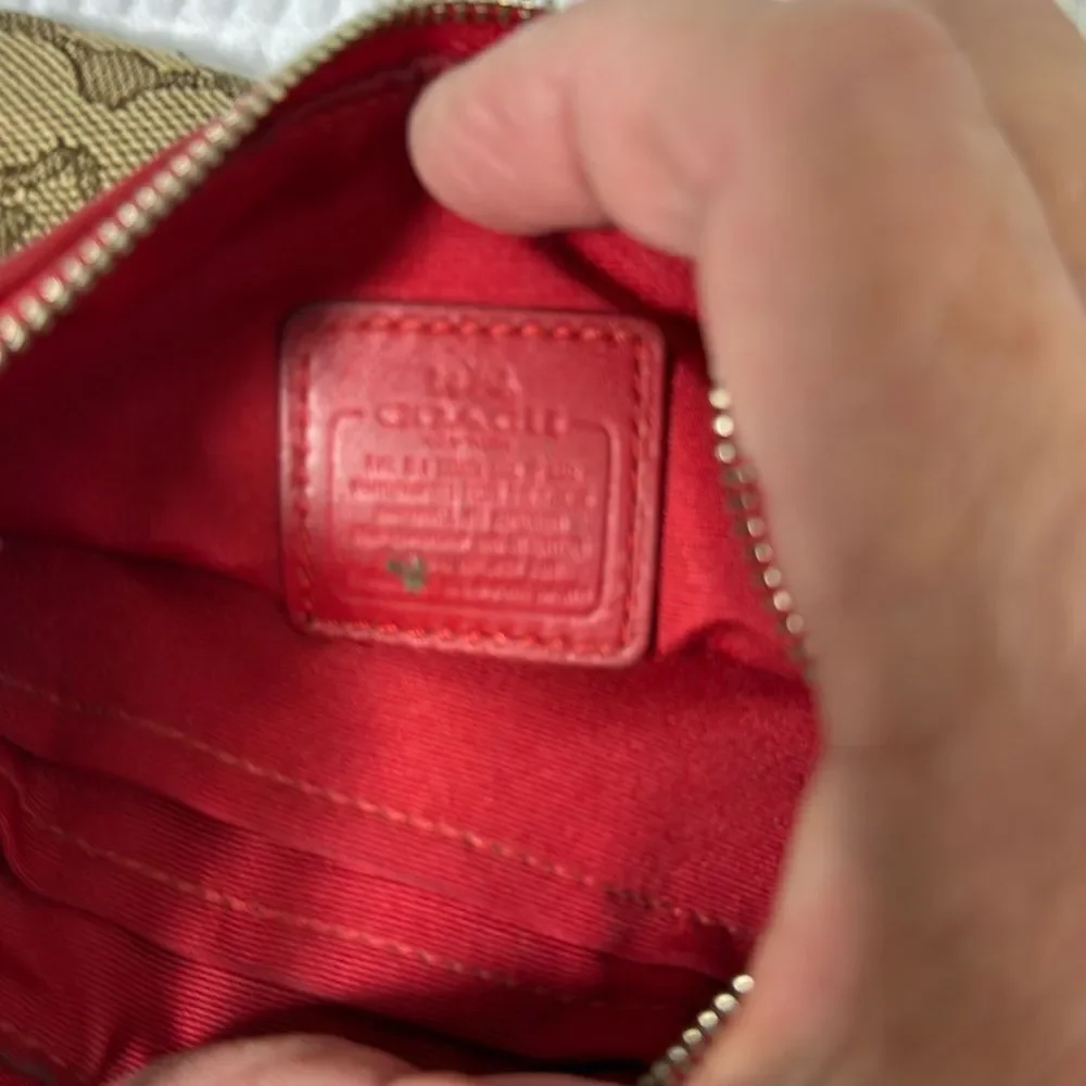 Coach tan and red Wristlet with Logo Pattern